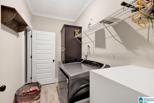 washroom with independent washer and dryer, ornamental molding, and cabinets