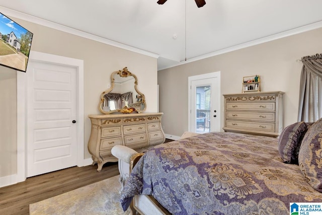 bedroom featuring crown molding, ceiling fan, and dark hardwood / wood-style flooring