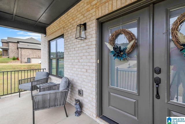 doorway to property with covered porch