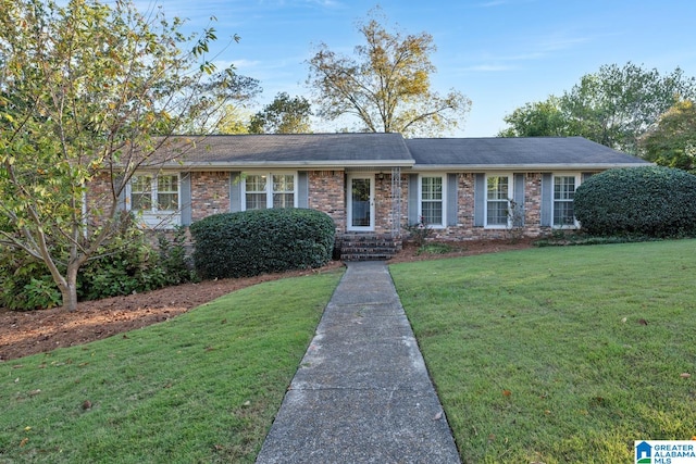 ranch-style house with a front lawn