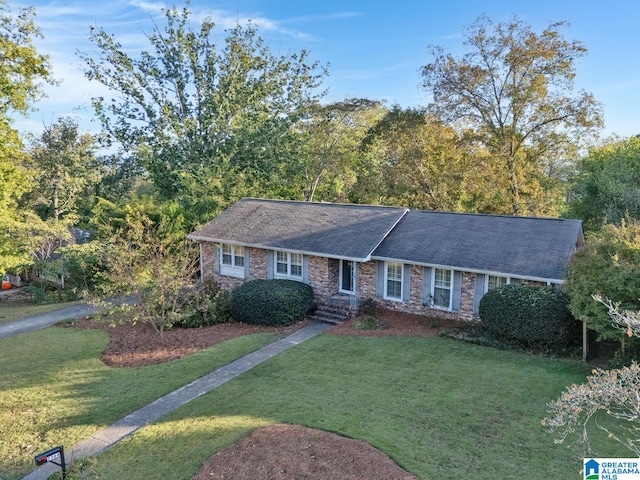 ranch-style home with a front yard