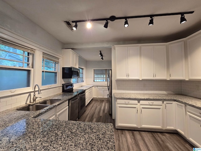 kitchen featuring dark wood-style flooring, white cabinets, stainless steel appliances, and a sink