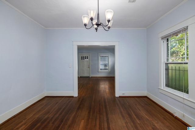 unfurnished room with a chandelier, ornamental molding, baseboards, and wood-type flooring