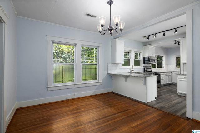 kitchen featuring stainless steel appliances, kitchen peninsula, a kitchen breakfast bar, dark hardwood / wood-style floors, and white cabinets