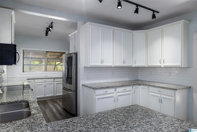 kitchen featuring light stone countertops, dark wood finished floors, white cabinets, smart refrigerator, and backsplash