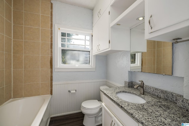 full bath featuring vanity, toilet, wood finished floors, and wainscoting