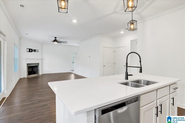 kitchen with white cabinets, sink, pendant lighting, dishwasher, and an island with sink