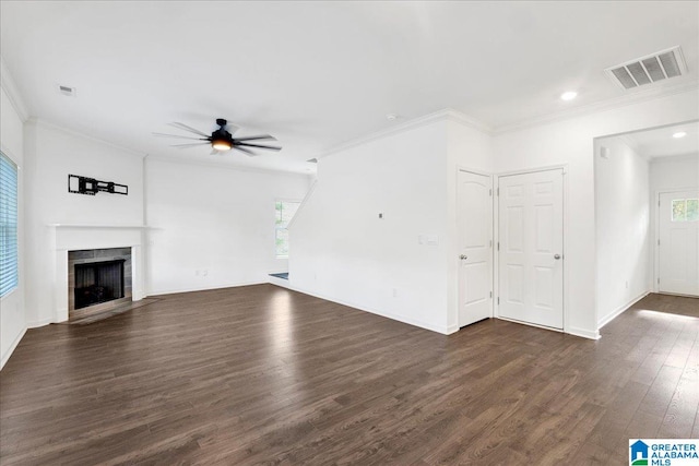 unfurnished living room with ceiling fan, dark wood-type flooring, and ornamental molding