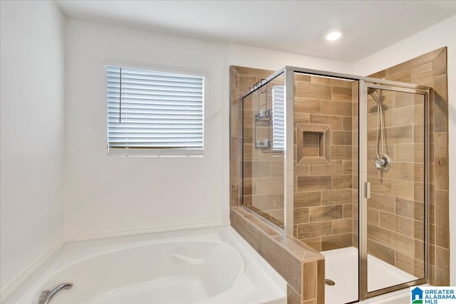 bathroom with shower with separate bathtub