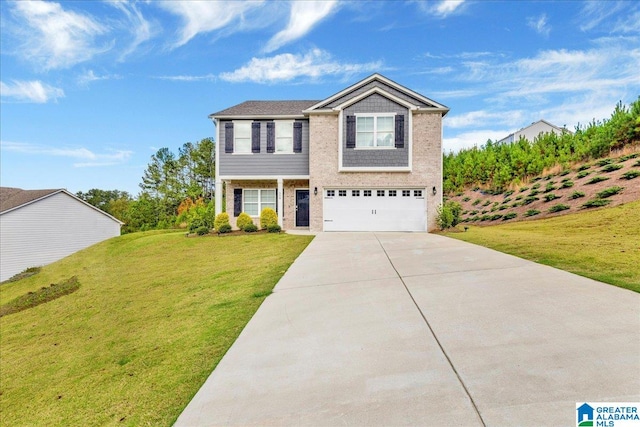 view of front of home with a front yard and a garage