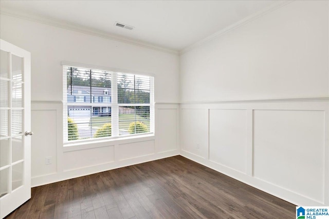 unfurnished room featuring crown molding and dark wood-type flooring