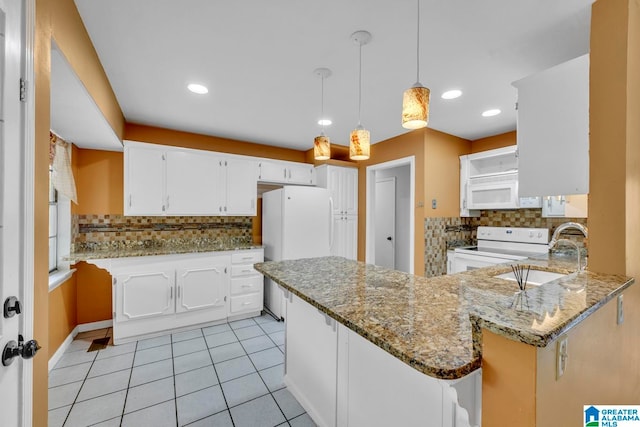 kitchen featuring hanging light fixtures, kitchen peninsula, sink, white cabinets, and white appliances