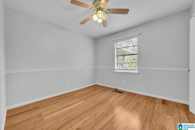 empty room with light hardwood / wood-style floors and ceiling fan