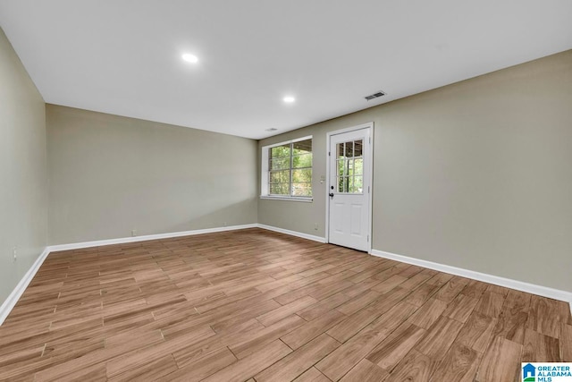 empty room with light hardwood / wood-style floors