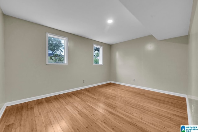 unfurnished room with light wood-type flooring