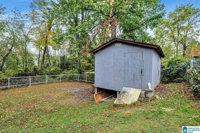 view of outbuilding featuring a yard