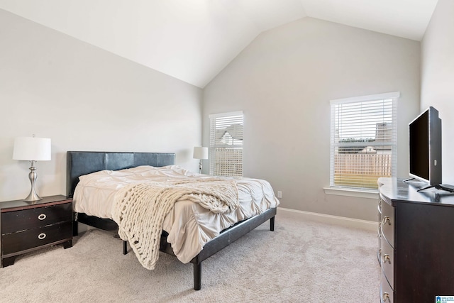 569 Avondale Ln, Pell City, AL 35128 - bedroom with vaulted ceiling, light carpet, and baseboards