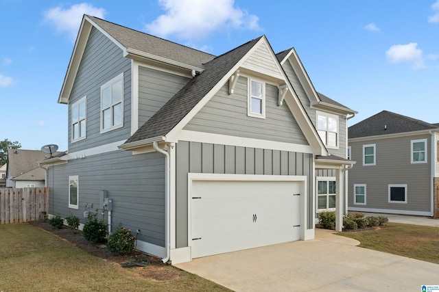 view of front of house featuring a garage and a front lawn