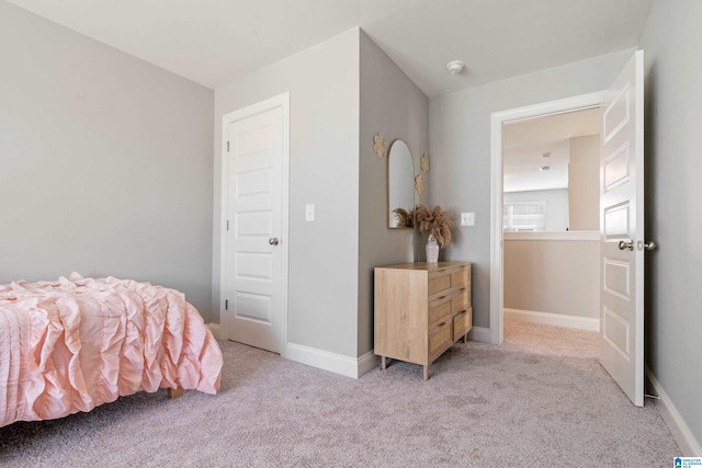 bedroom with light carpet