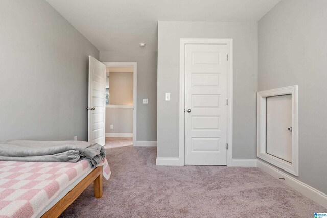 569 Avondale Ln, Pell City, AL 35128 - carpeted bedroom with baseboards
