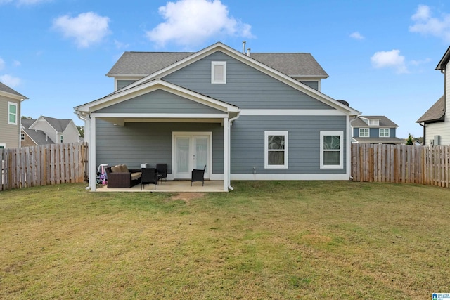 569 Avondale Ln, Pell City, AL 35128 - rear view of house with french doors, a patio, an outdoor hangout area, and a shingled roof