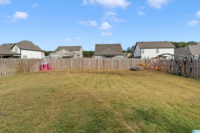 569 Avondale Ln, Pell City, AL 35128 - view of grassy yard featuring a residential view