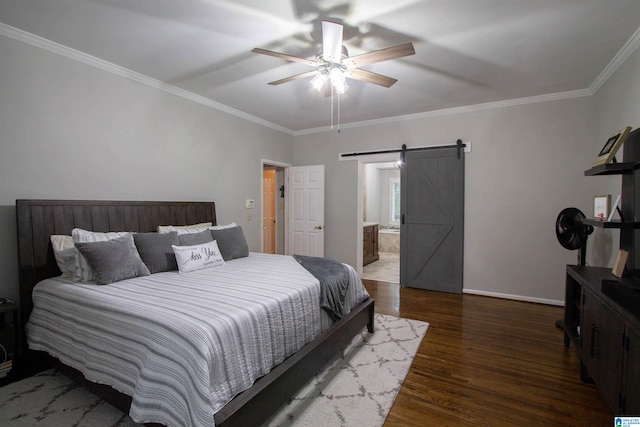 bedroom featuring a barn door, connected bathroom, ornamental molding, ceiling fan, and dark hardwood / wood-style floors