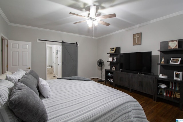 bedroom with a barn door, connected bathroom, ornamental molding, ceiling fan, and dark hardwood / wood-style floors