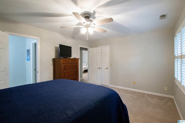 bedroom featuring ceiling fan and light colored carpet