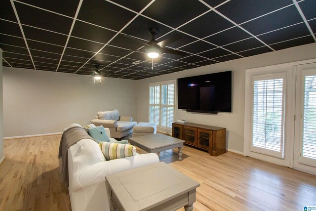 living room featuring hardwood / wood-style floors and ceiling fan