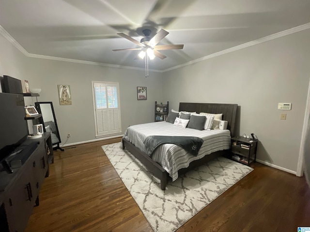 bedroom featuring dark hardwood / wood-style flooring, ceiling fan, and crown molding