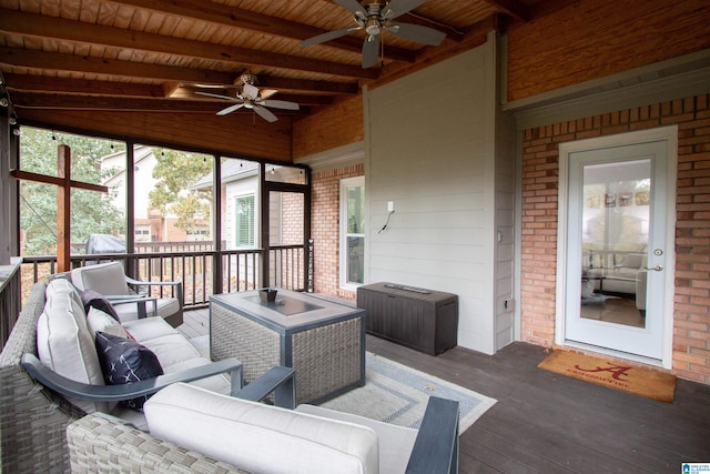 sunroom / solarium with ceiling fan, wood ceiling, and lofted ceiling with beams