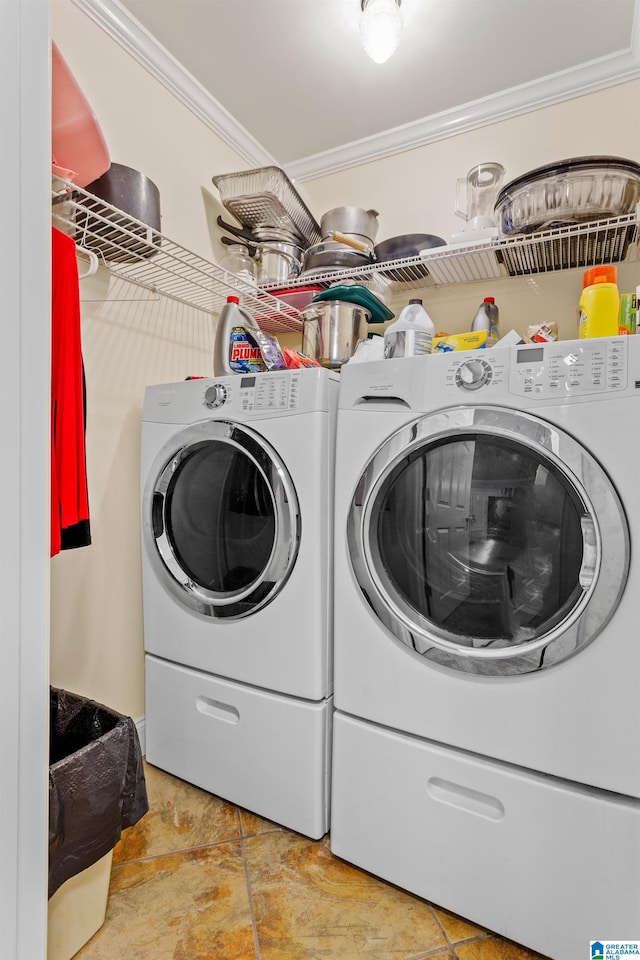 laundry room with washing machine and dryer and ornamental molding