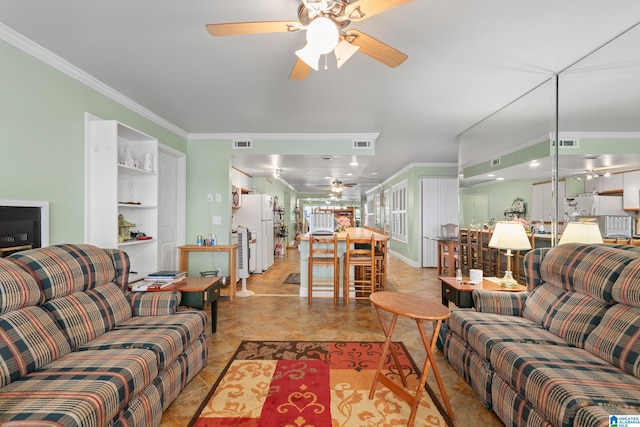 tiled living room with ceiling fan and ornamental molding