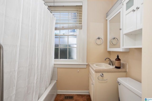 full bathroom featuring vanity, toilet, and shower / bath combo with shower curtain