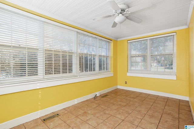 unfurnished sunroom with ceiling fan