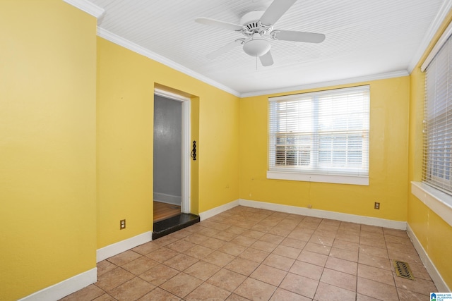 tiled spare room featuring ornamental molding and ceiling fan