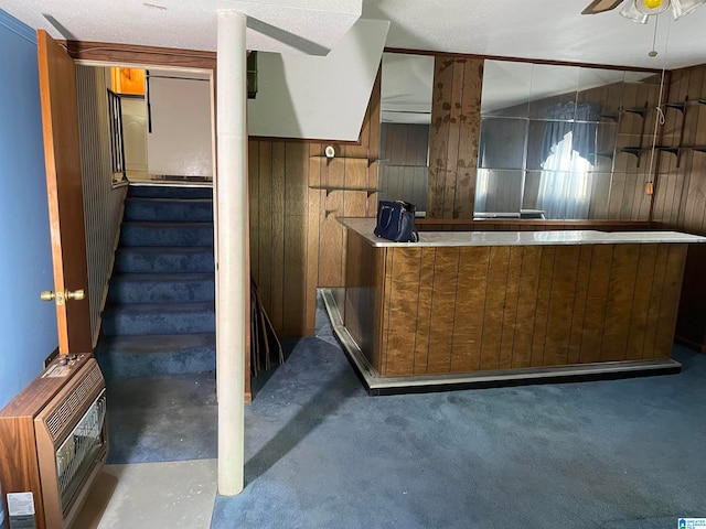 reception area featuring heating unit and ceiling fan