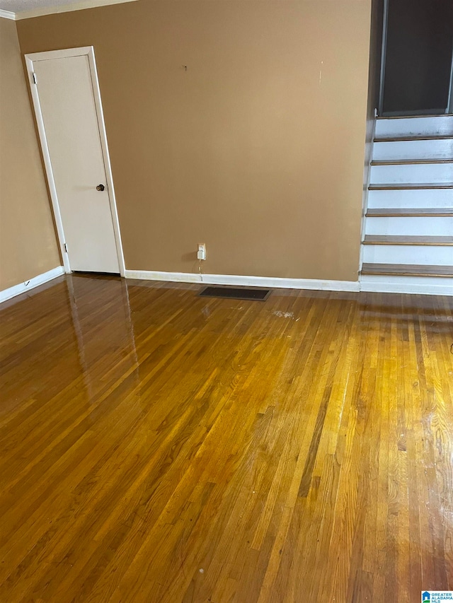 spare room with hardwood / wood-style flooring