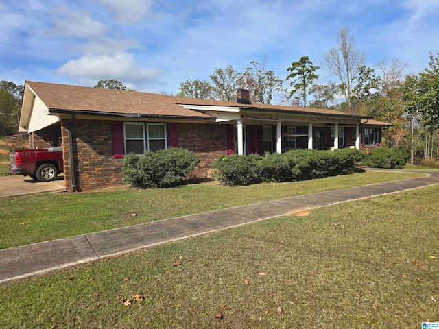 ranch-style home featuring a front yard