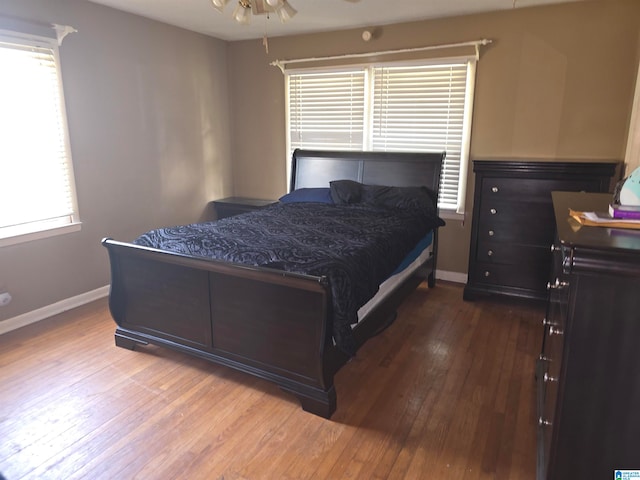 bedroom featuring hardwood / wood-style floors and ceiling fan