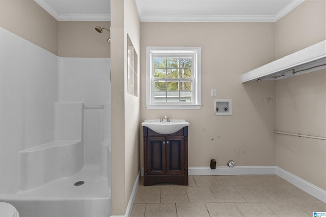 bathroom featuring toilet, tile patterned flooring, crown molding, vanity, and walk in shower