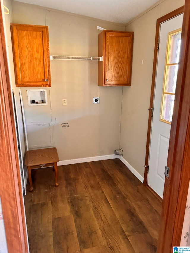 washroom featuring electric dryer hookup, hookup for a washing machine, dark hardwood / wood-style floors, and cabinets