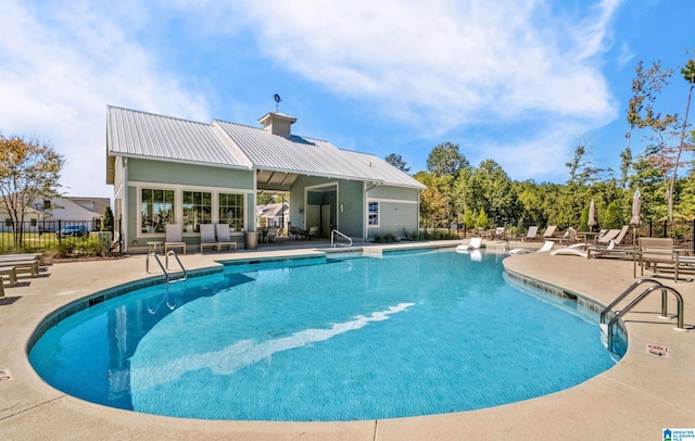 view of swimming pool featuring a patio