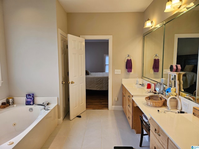 bathroom with vanity, tile patterned flooring, and a bathing tub