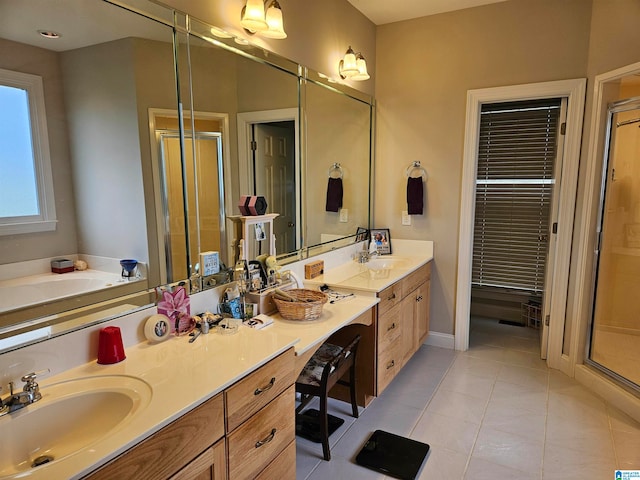 bathroom featuring vanity, tile patterned floors, and shower with separate bathtub