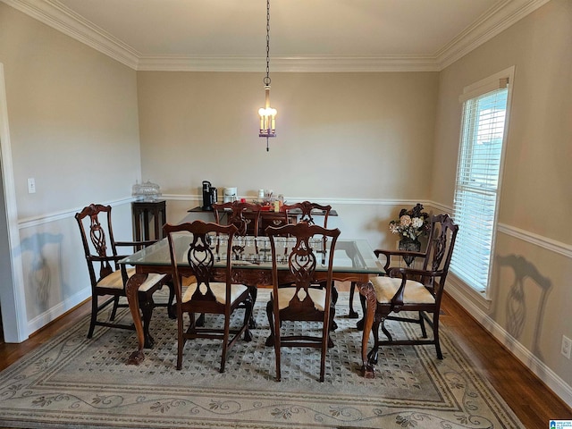 dining room featuring crown molding and hardwood / wood-style flooring