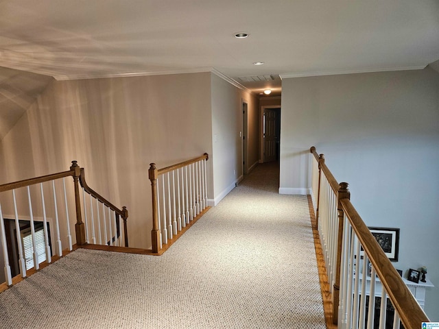 hallway with carpet and ornamental molding