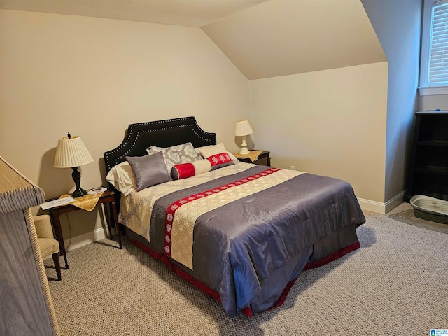 bedroom featuring vaulted ceiling and light colored carpet