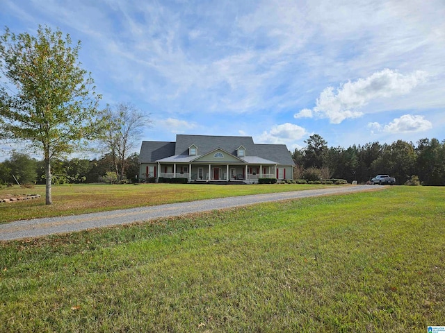 view of front of home featuring covered porch and a front lawn